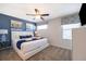 Spacious Primary bedroom with a king-size bed and calming decor at 8956 Hilton Ridge Ave, Kissimmee, FL 34747