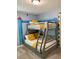 bedroom with a bunk bed and fun mural at 8956 Hilton Ridge Ave, Kissimmee, FL 34747