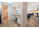 Bright entryway with built-in desk and view into the kitchen at 8956 Hilton Ridge Ave, Kissimmee, FL 34747