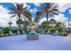 Relaxing fire pit area with seating and landscaping at 8956 Hilton Ridge Ave, Kissimmee, FL 34747