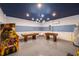 Basement game room with air hockey, foosball, and Marvel mural at 8956 Hilton Ridge Ave, Kissimmee, FL 34747