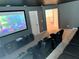 Spacious home theater with ample seating and a large projector screen at 8956 Hilton Ridge Ave, Kissimmee, FL 34747