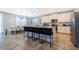 Modern kitchen with white cabinets, a large island, and stainless steel appliances at 8956 Hilton Ridge Ave, Kissimmee, FL 34747