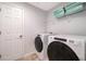 Laundry room with washer, dryer, and shelving at 8956 Hilton Ridge Ave, Kissimmee, FL 34747