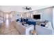 Spacious living area featuring a sectional sofa and a large TV at 8956 Hilton Ridge Ave, Kissimmee, FL 34747