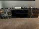 Industrial-style media console with ample storage for electronics at 8956 Hilton Ridge Ave, Kissimmee, FL 34747