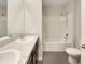 Bathroom with shower/tub combo, double vanity, and tile floor at 127 Hickory Crse, Ocala, FL 34472
