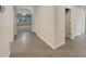 Bright hallway with tile floors and views into the living room at 127 Hickory Crse, Ocala, FL 34472