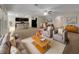 Open concept living room, kitchen, and dining area with modern appliances and island at 127 Hickory Crse, Ocala, FL 34472