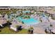 Resort-style pool and community amenity area with expansive deck and lounge chairs at 1680 Moon Valley Dr, Davenport, FL 33896