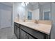 Double vanity bathroom with dark brown cabinets and a light-colored countertop at 1680 Moon Valley Dr, Davenport, FL 33896