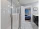 Clean bathroom with a walk-in shower and marble tile floor at 1680 Moon Valley Dr, Davenport, FL 33896