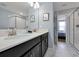Elegant bathroom with double vanity, large mirror, and walk-in shower at 1680 Moon Valley Dr, Davenport, FL 33896