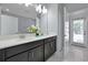 Double vanity bathroom with modern finishes at 1680 Moon Valley Dr, Davenport, FL 33896