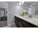 Double vanity bathroom with modern finishes at 1680 Moon Valley Dr, Davenport, FL 33896