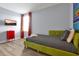Bright bedroom with a twin bed, TV, and Toy Story themed wall at 1680 Moon Valley Dr, Davenport, FL 33896