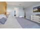 King-size bed, dresser, and access to other rooms at 1680 Moon Valley Dr, Davenport, FL 33896