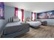 Bedroom with three twin beds, themed decor, and wood-look floors at 1680 Moon Valley Dr, Davenport, FL 33896