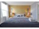 Large bedroom with king-size bed and accent wall at 1680 Moon Valley Dr, Davenport, FL 33896