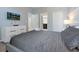 Main bedroom with en-suite bathroom and large dresser at 1680 Moon Valley Dr, Davenport, FL 33896