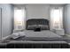 Elegant bedroom with a plush bed and accent wall at 1680 Moon Valley Dr, Davenport, FL 33896