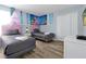 Bedroom with two twin beds, themed decor, and wood-look floors at 1680 Moon Valley Dr, Davenport, FL 33896