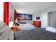 Bedroom with three twin beds, themed decor, and wood-look floors at 1680 Moon Valley Dr, Davenport, FL 33896