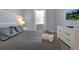 Bedroom with a large bed, dresser, and wall-mounted TV at 1680 Moon Valley Dr, Davenport, FL 33896