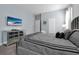Bedroom with a large TV and dresser at 1680 Moon Valley Dr, Davenport, FL 33896