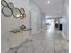 Bright and spacious entryway with a modern console table and mirror at 1680 Moon Valley Dr, Davenport, FL 33896