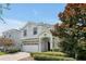 Two-story house with a white exterior and landscaping at 1680 Moon Valley Dr, Davenport, FL 33896