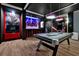 Game room with pool table and arcade games at 1680 Moon Valley Dr, Davenport, FL 33896