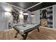 Game room with pool table and Star Wars themed wall art at 1680 Moon Valley Dr, Davenport, FL 33896