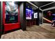 Game room with red accents, Star Wars decor, and gaming consoles at 1680 Moon Valley Dr, Davenport, FL 33896