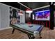Fun game room with pool table, Star Wars themed decor, and gaming station at 1680 Moon Valley Dr, Davenport, FL 33896