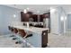 Modern kitchen with dark cabinets and white countertops at 1680 Moon Valley Dr, Davenport, FL 33896