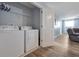 Convenient laundry room with washer, dryer, and shelving at 1680 Moon Valley Dr, Davenport, FL 33896