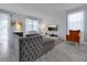 Open living room with sectional sofa and large TV at 1680 Moon Valley Dr, Davenport, FL 33896