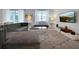Spacious living area featuring a sectional sofa and a large TV at 1680 Moon Valley Dr, Davenport, FL 33896