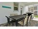 Outdoor patio with dining table, chairs, and a built-in gas grill at 1680 Moon Valley Dr, Davenport, FL 33896