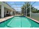 Refreshing pool and spa with screened enclosure and spacious patio at 1680 Moon Valley Dr, Davenport, FL 33896