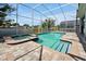 Inviting screened pool and spa with ample surrounding patio space at 1680 Moon Valley Dr, Davenport, FL 33896