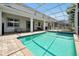 Relaxing pool and spa surrounded by a spacious patio and screened enclosure at 1680 Moon Valley Dr, Davenport, FL 33896