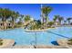 Resort-style pool with a waterslide and plenty of lounge chairs at 1680 Moon Valley Dr, Davenport, FL 33896