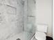Bathroom with a walk-in shower and grey marble tile at 2711 Emerald Lake Ct, Kissimmee, FL 34744