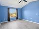 Bedroom with water view, vaulted ceiling and wood-look floors at 2711 Emerald Lake Ct, Kissimmee, FL 34744