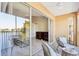 Screened balcony with view of lake and access to interior at 2711 Emerald Lake Ct, Kissimmee, FL 34744