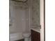 Clean bathroom with tub, toilet and vanity at 31541 Hillcrest Dr, Eustis, FL 32736