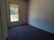 Bright bedroom with neutral carpeting and a window at 31541 Hillcrest Dr, Eustis, FL 32736