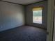 Simple bedroom with neutral walls and carpet at 31541 Hillcrest Dr, Eustis, FL 32736